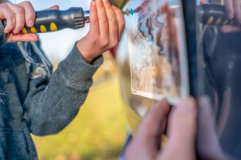 Affixing a license plate onto a vehicle