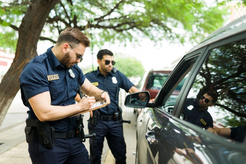 Police officers issuing ticket